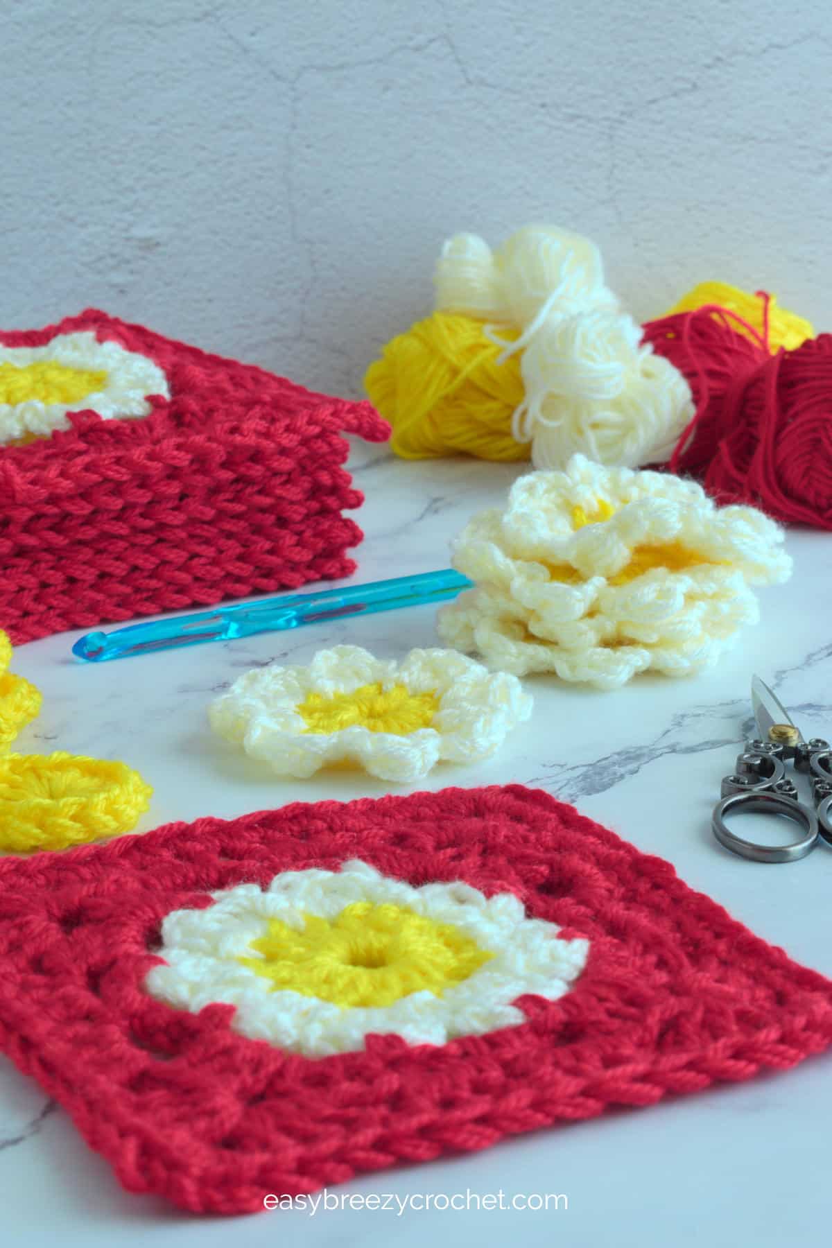 Image showing different stages of crocheting a large lacy granny square.
