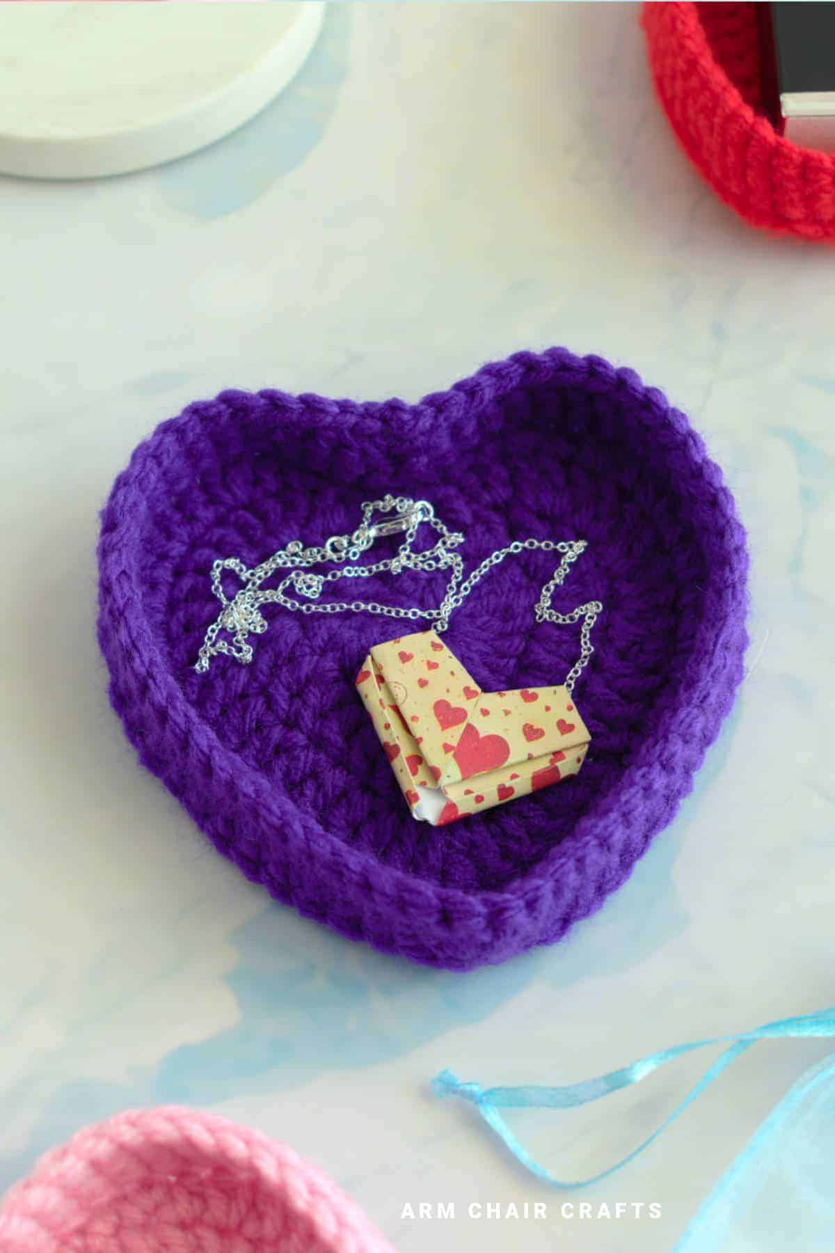 Purple crochet heart trinket box.