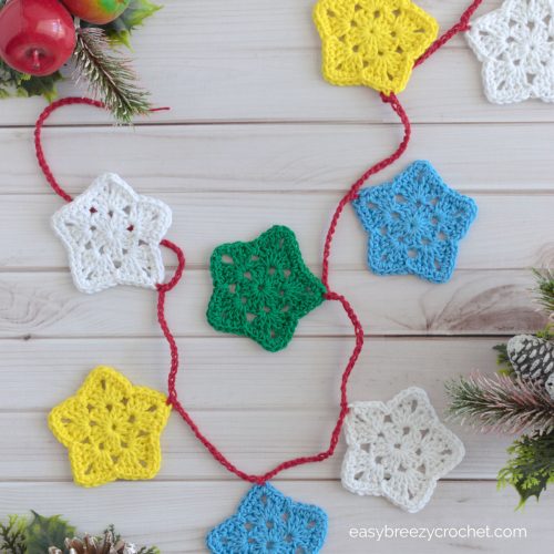 A top down photo of a crocheted star garland.