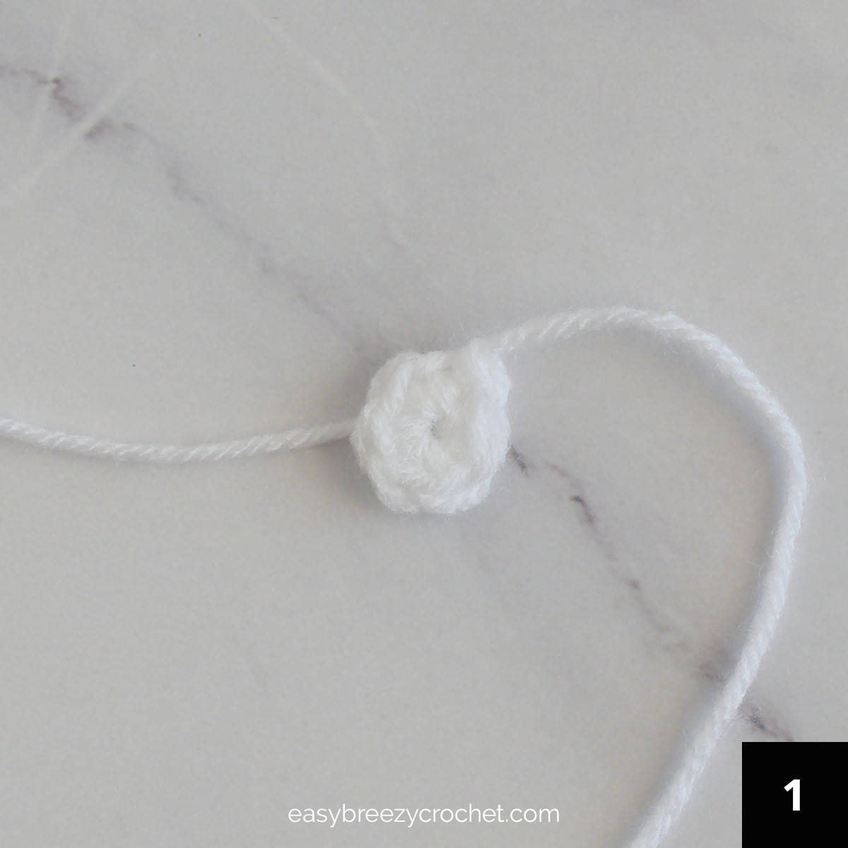 A small crocheted white cirlce.