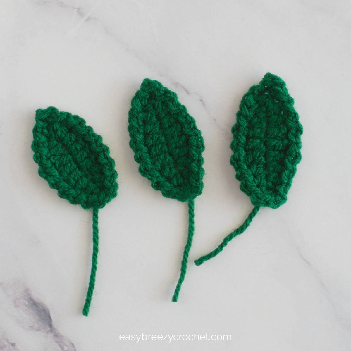Three crocheted leaves.