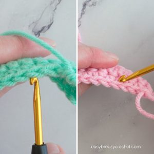 Image of pieces of pink and green crochet with crochet hooks.
