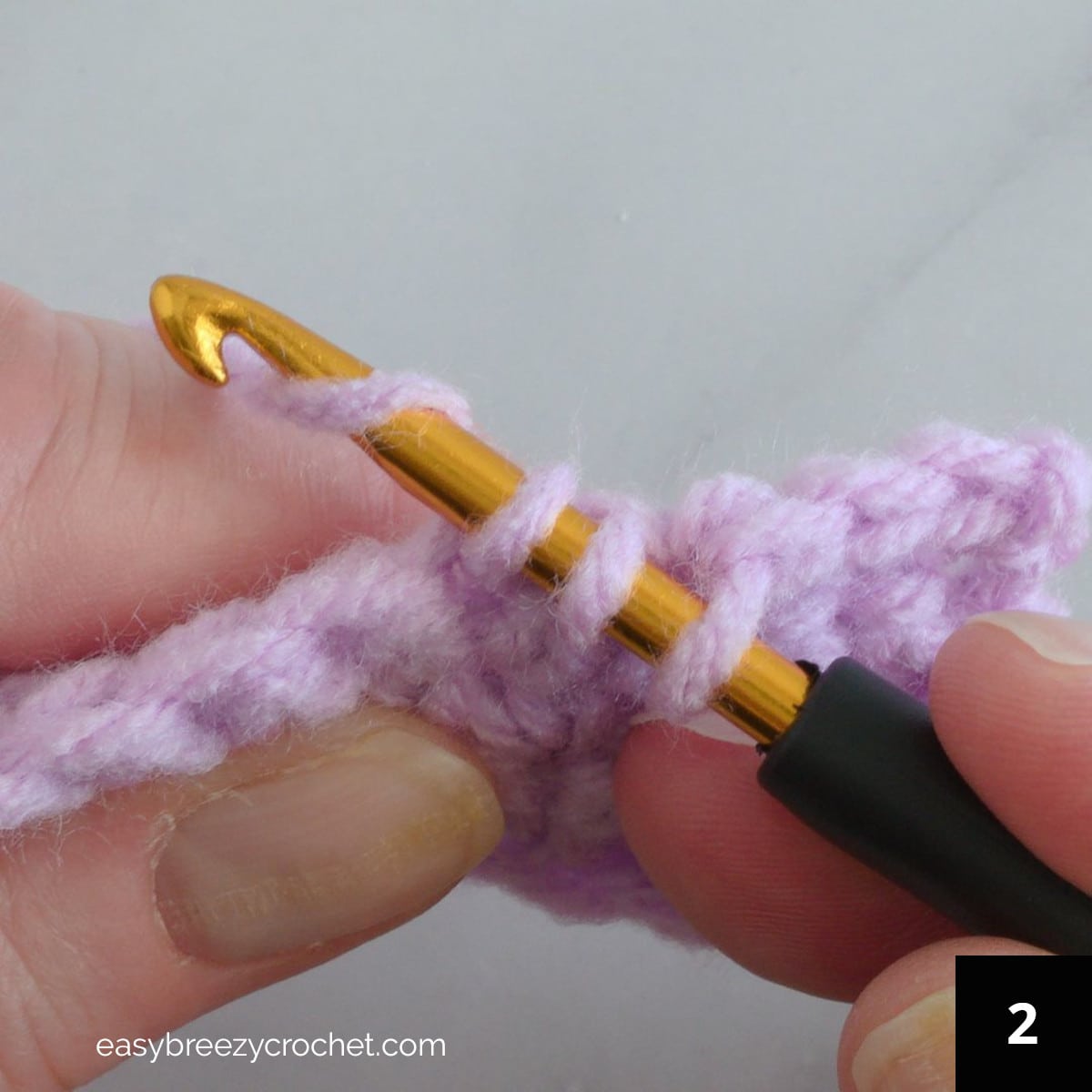 Step two of how to make a single crochet decrease.