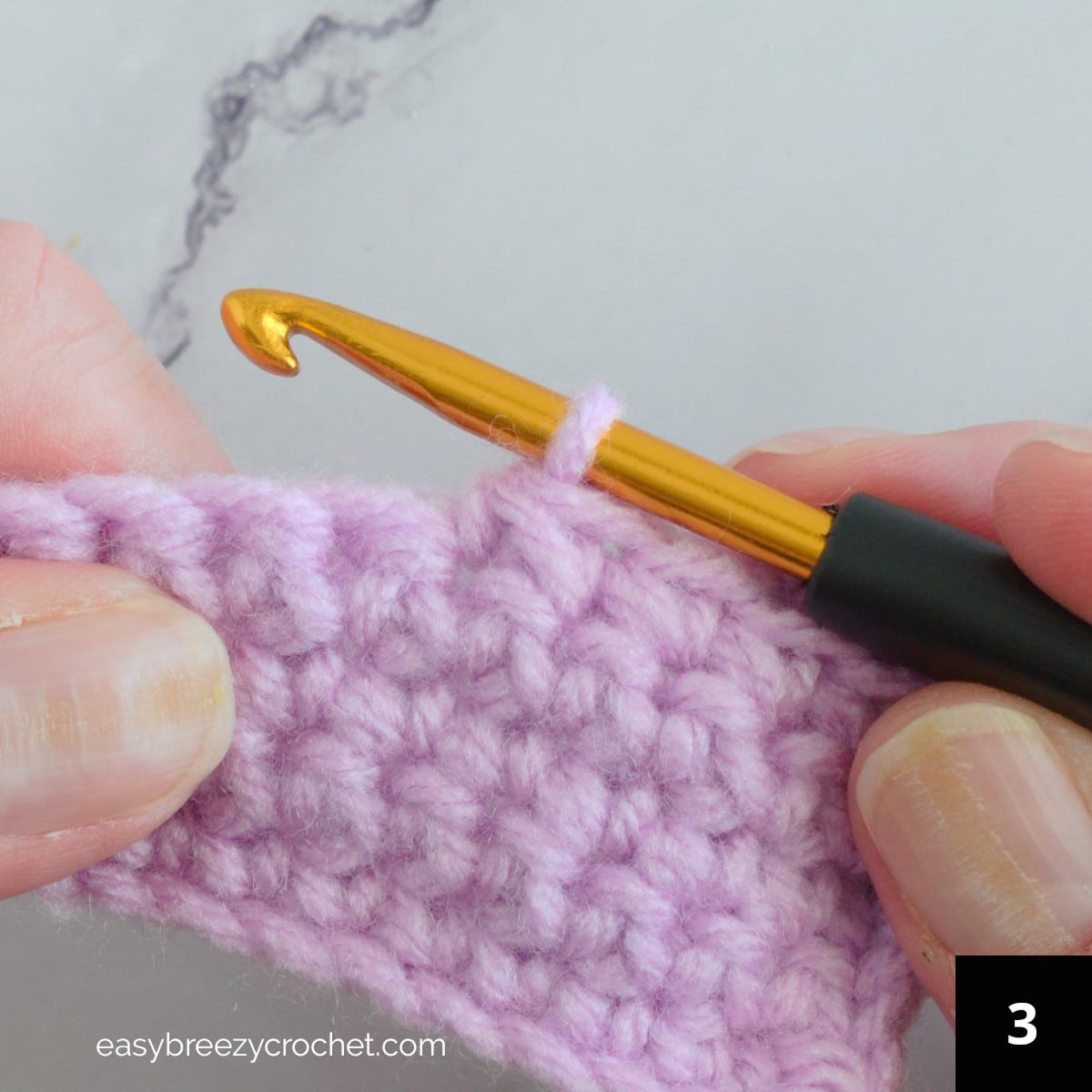 Step three of how to make a single crochet decrease.