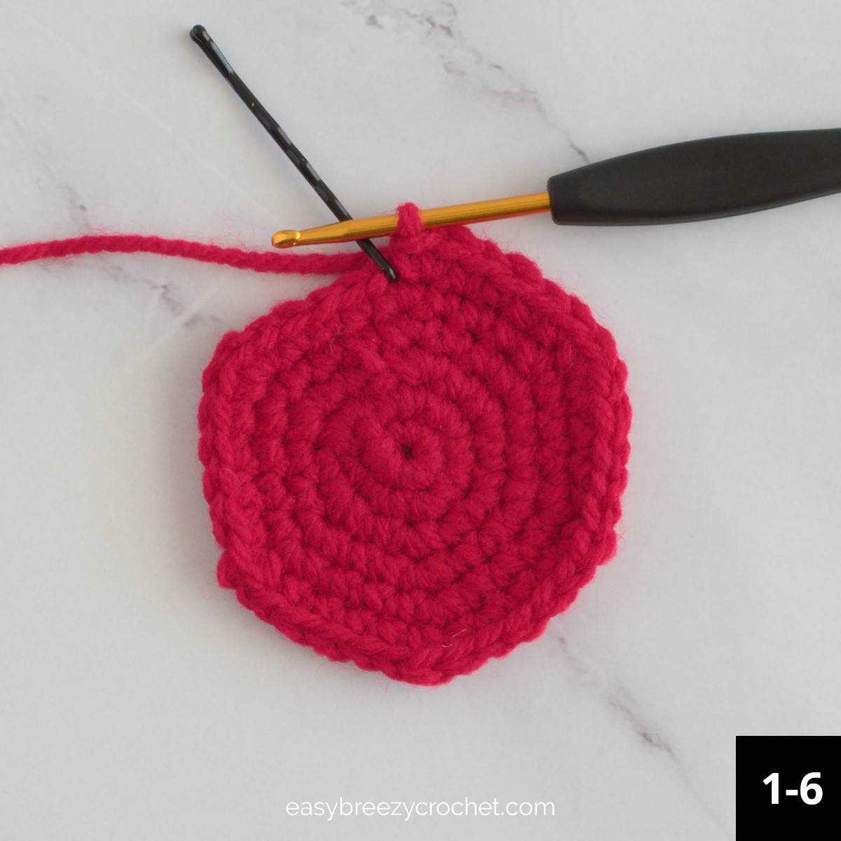 A red crochet circle.