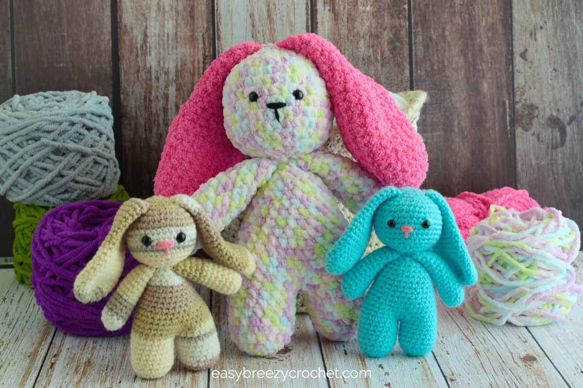 A large crochet bunny rabbit and two smaller ones.