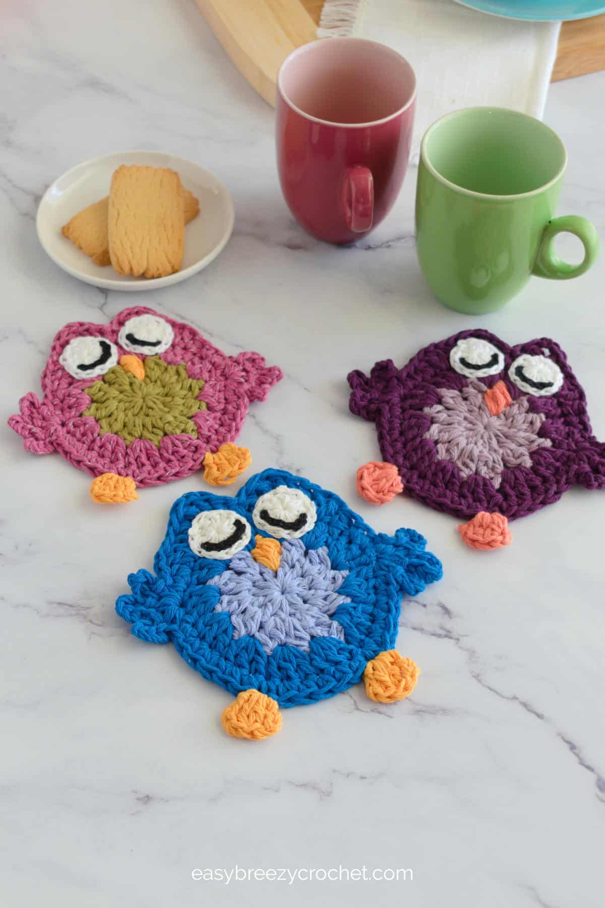 Pink, blue and purple crochet owls.