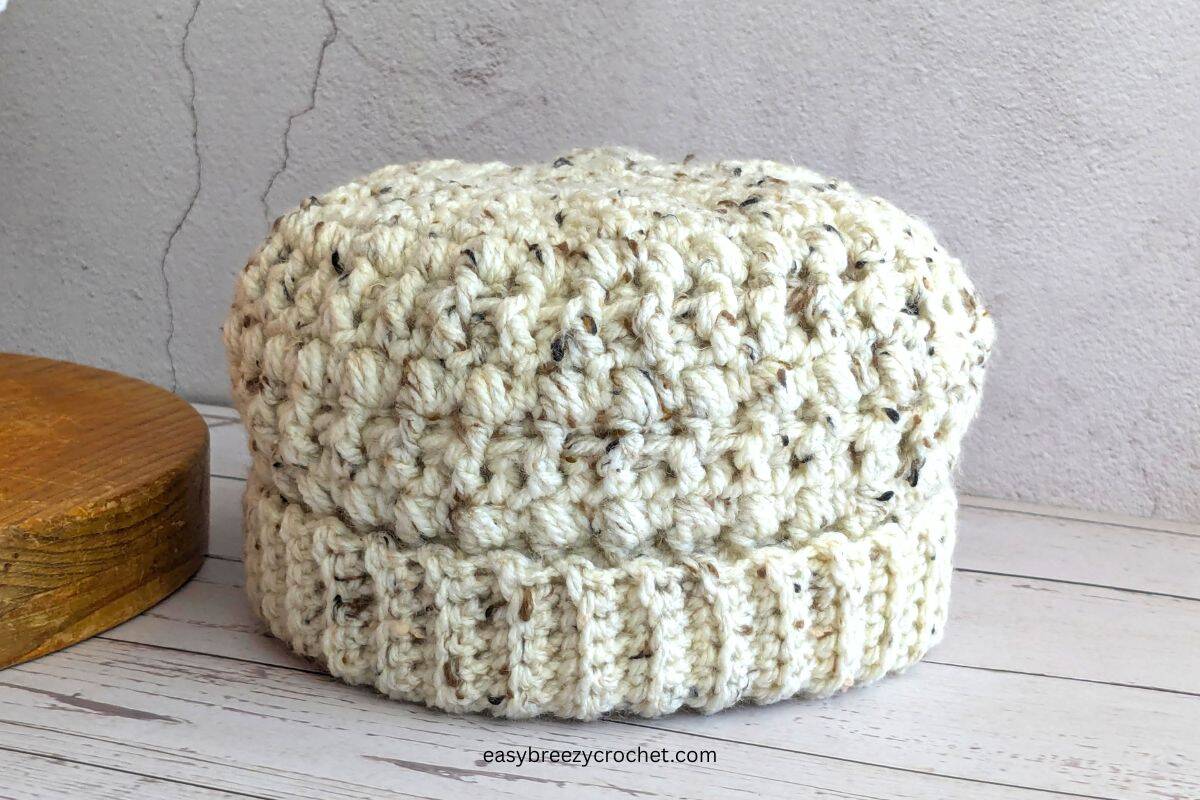 A tweed colored crochet beanie.