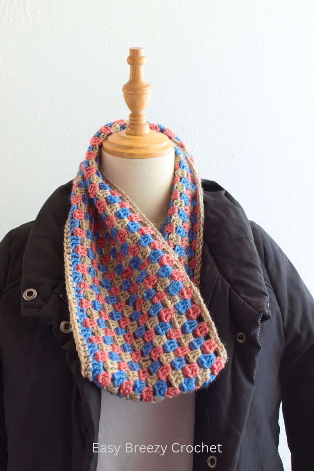 Crochet granny stitch cowl in pink, blue and taupe.
