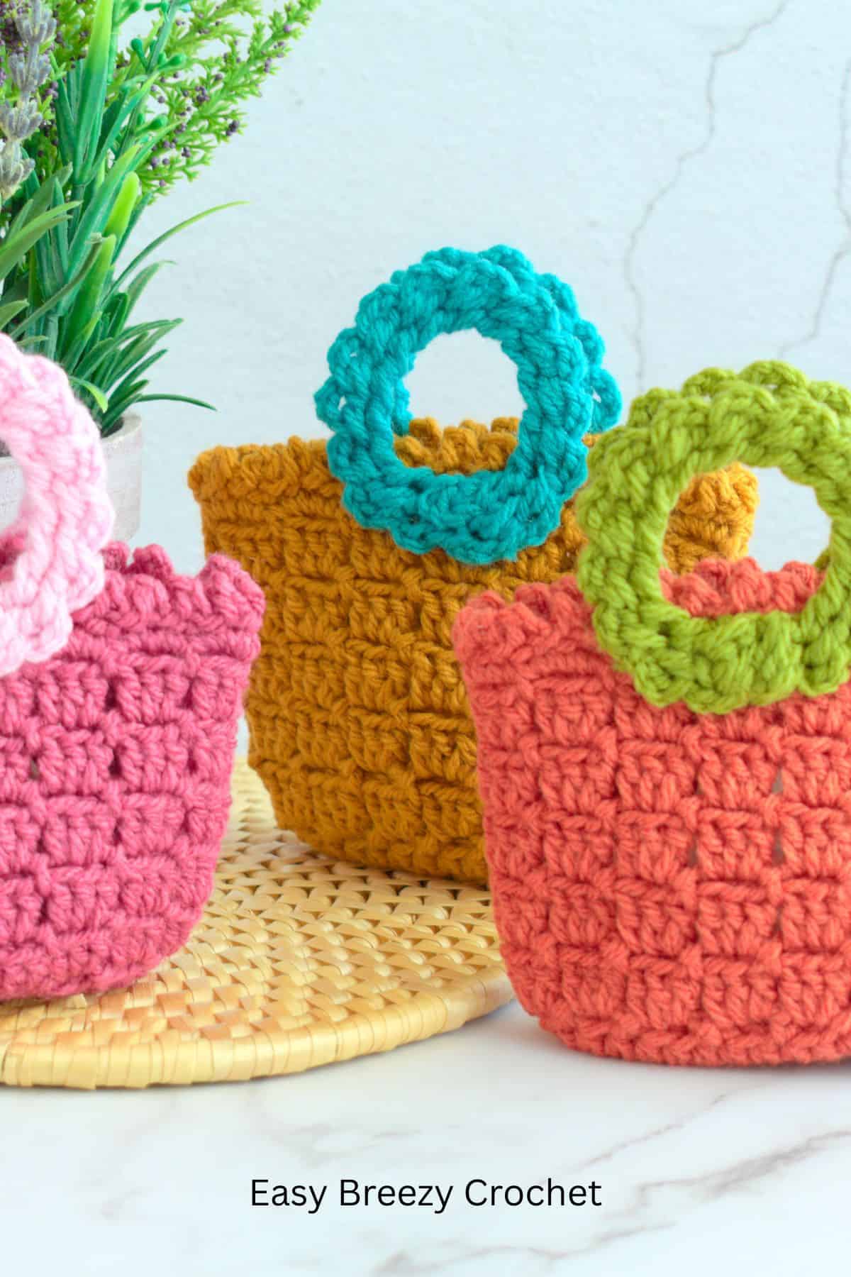 Three crochet gift bags.