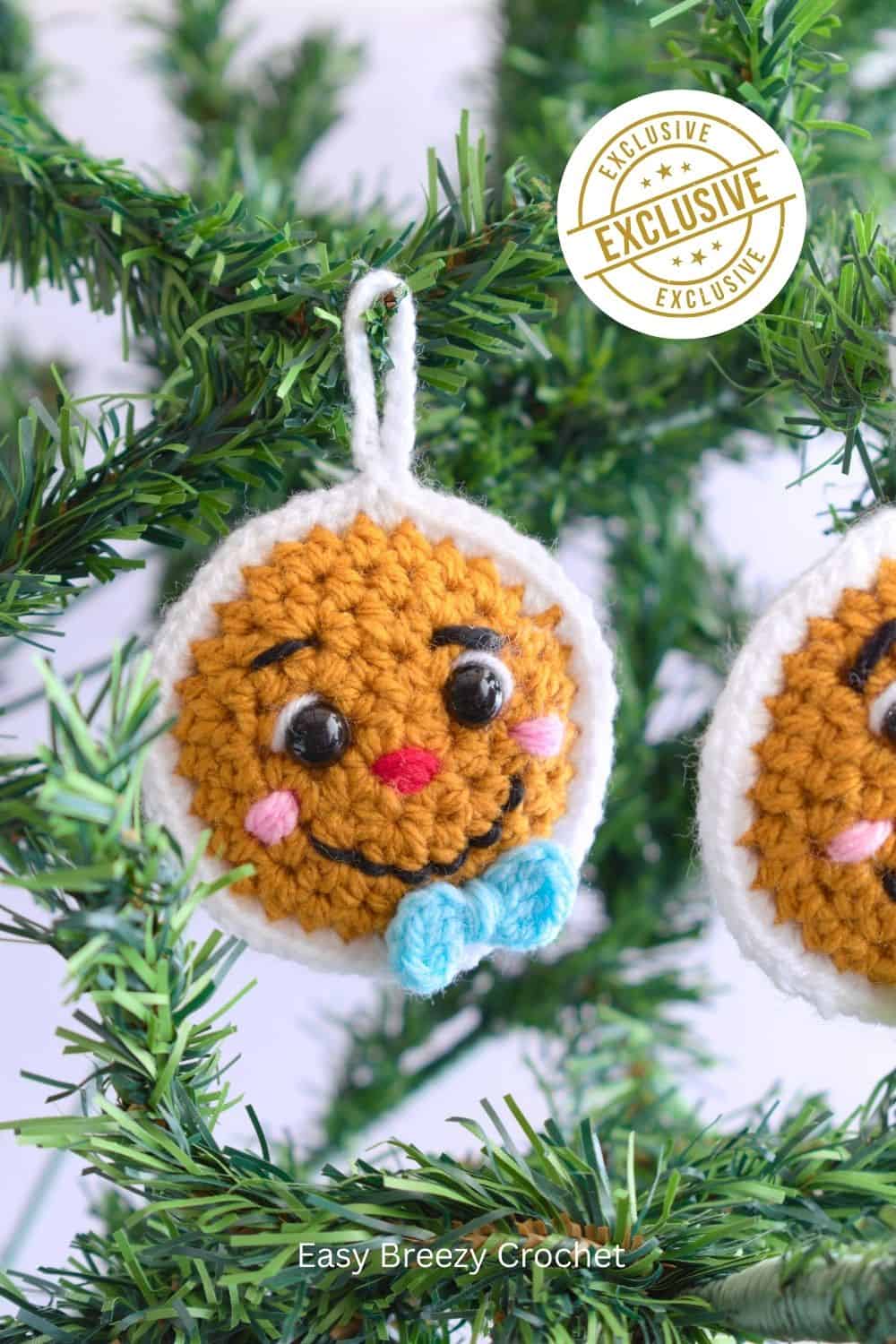 Crochet gingerbread ornament on a Christmas tree.