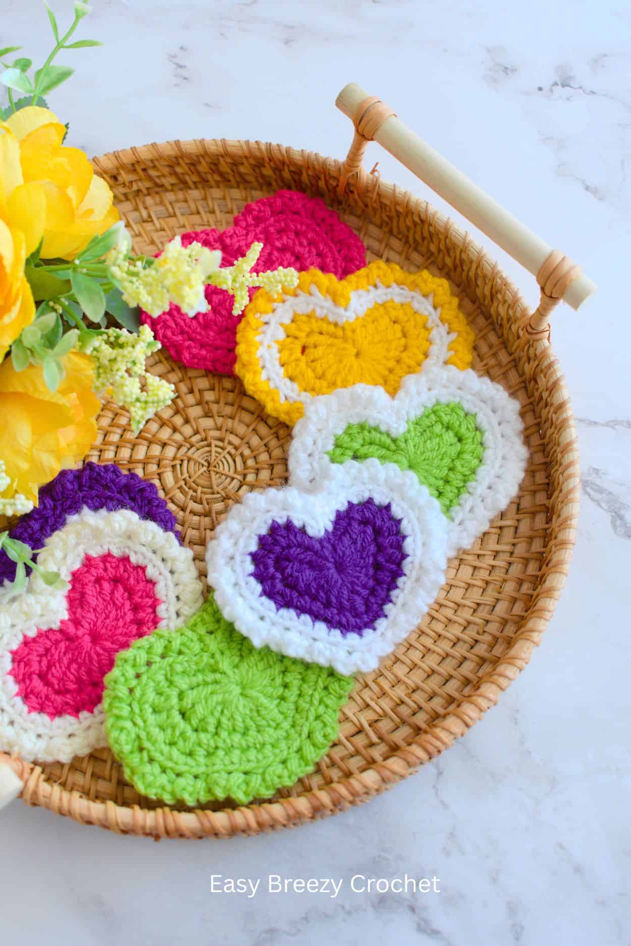 Crochet heart appliques in a cane tray.
