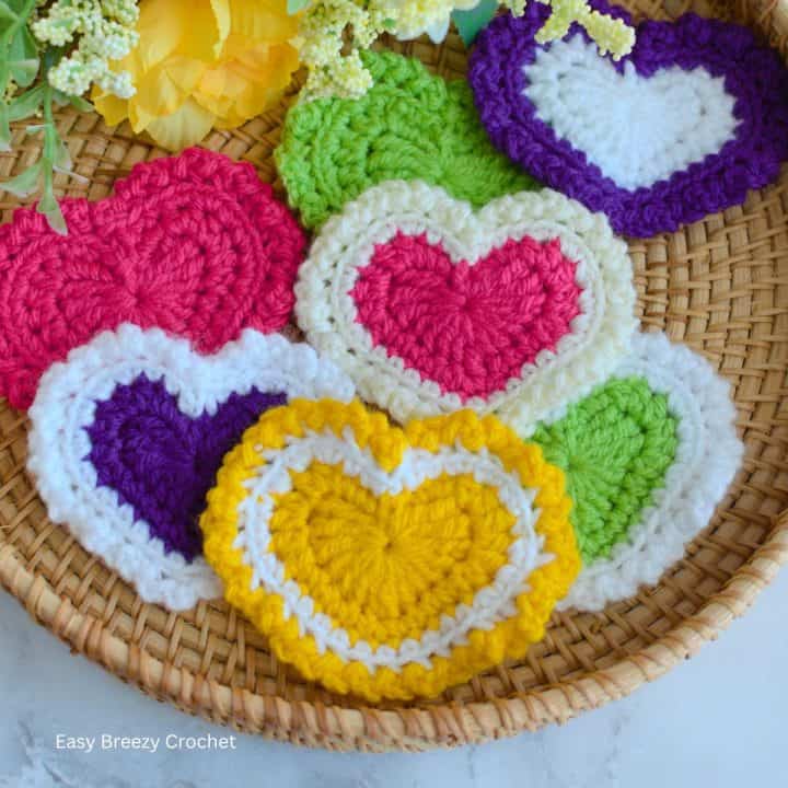 Multi colored crochet heart appliques.