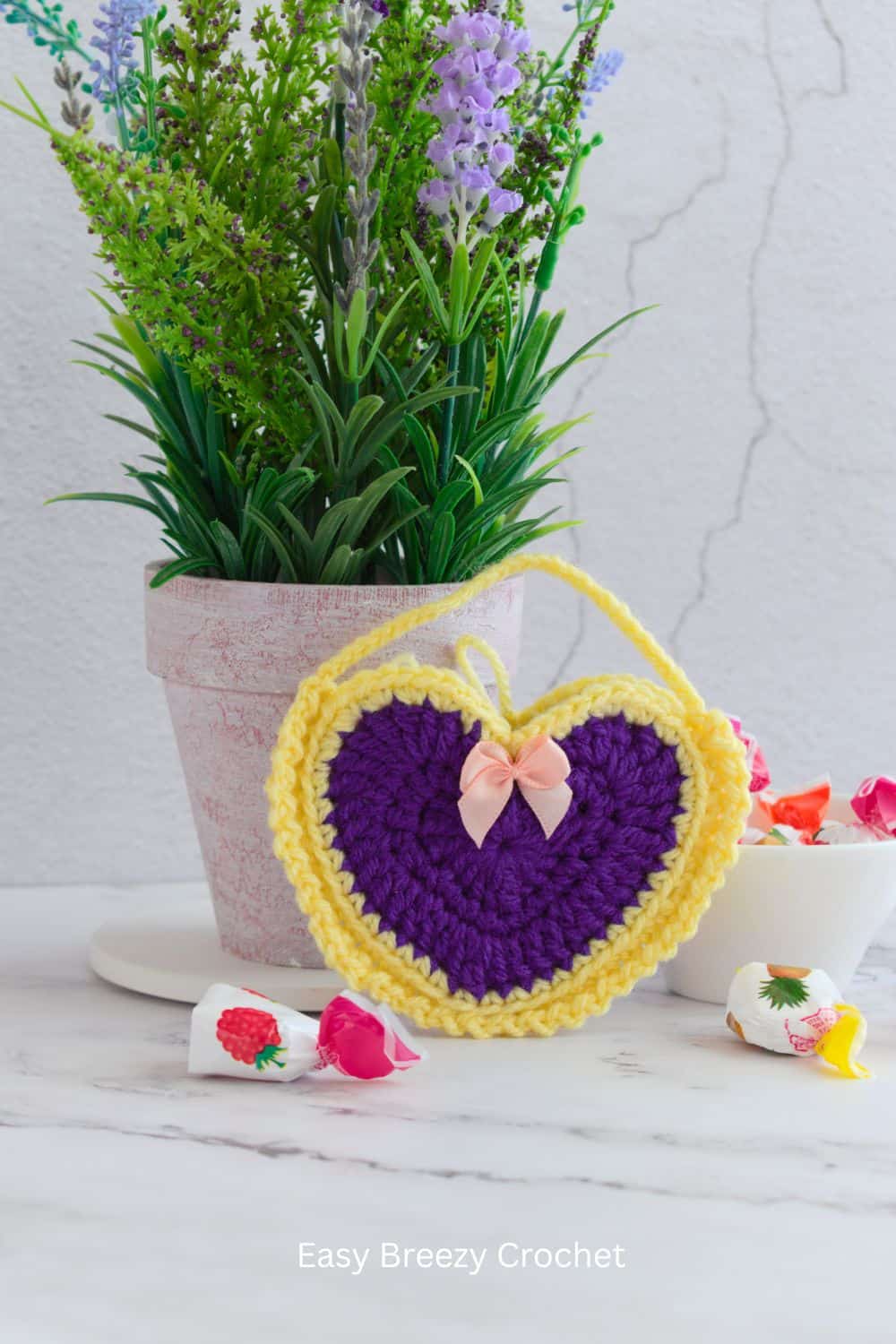 Purple and yellow crochet heart bag.