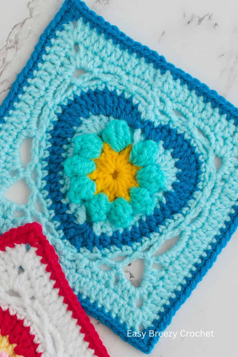 Closeup of a blue heart granny square.