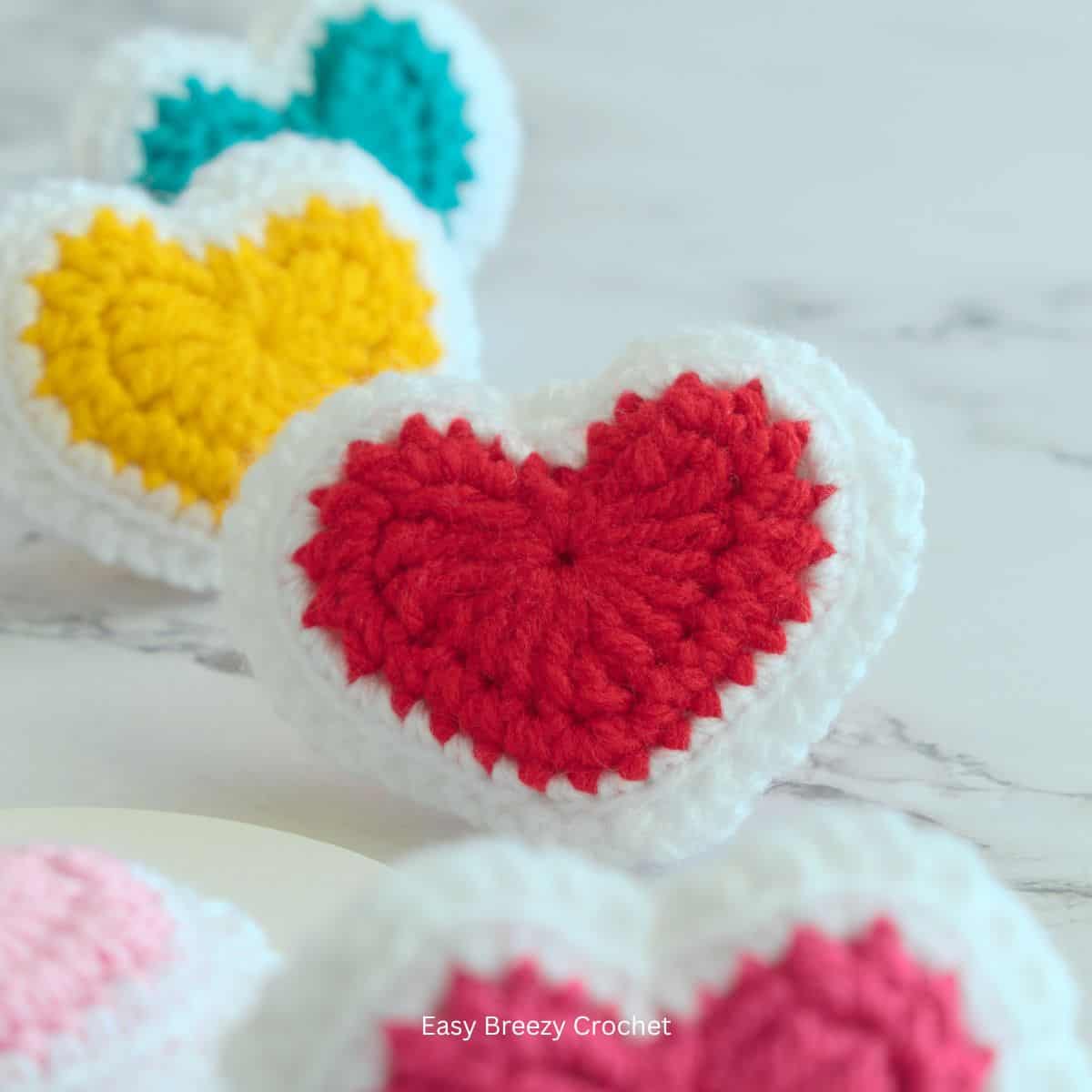 A red and white crochet heart.