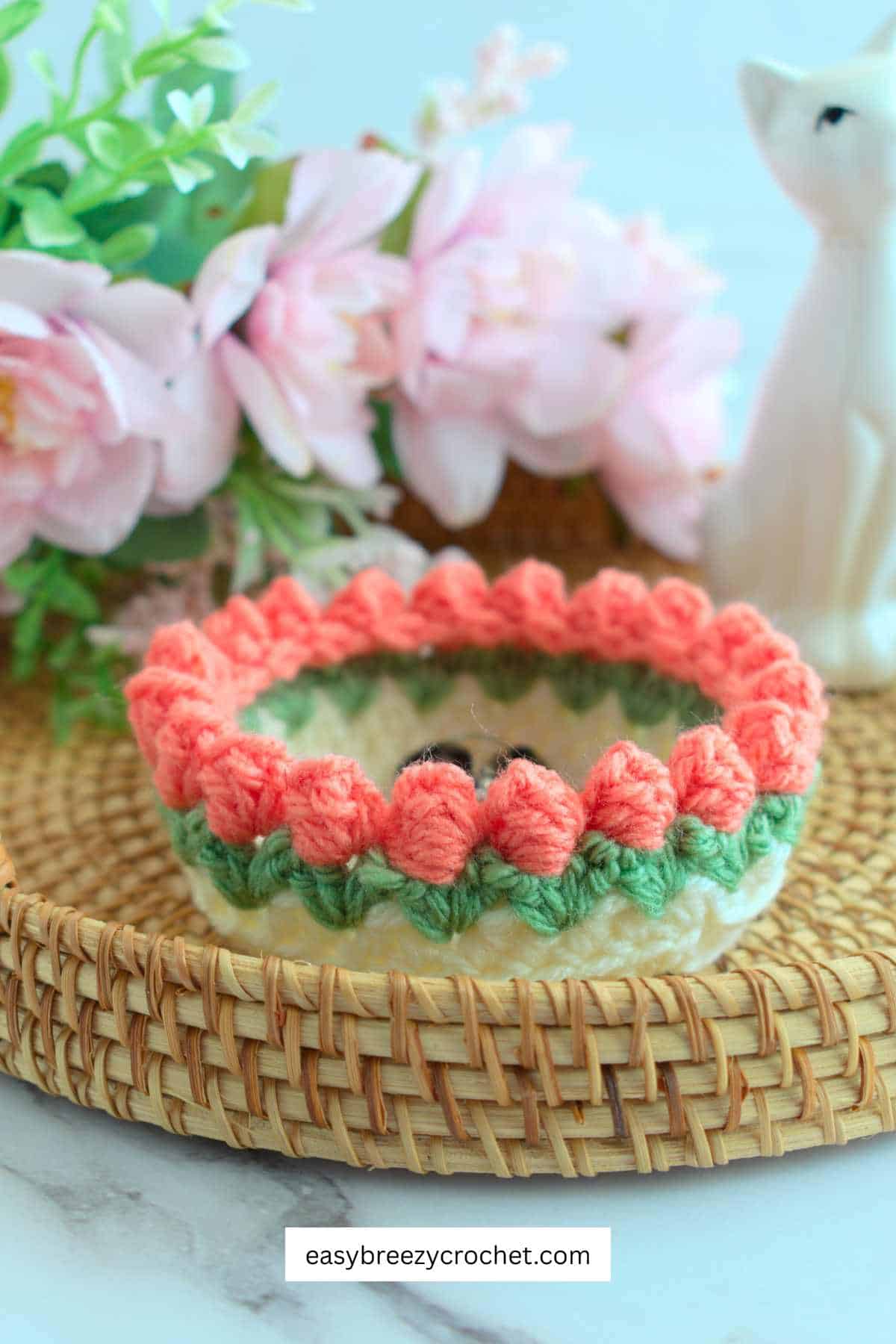 Orange and white crochet trinket dish.