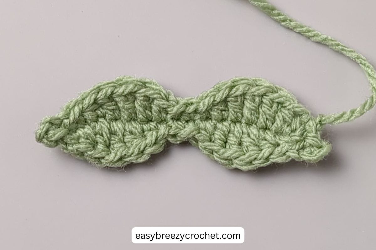 A crochet leaf for a bag charm.
