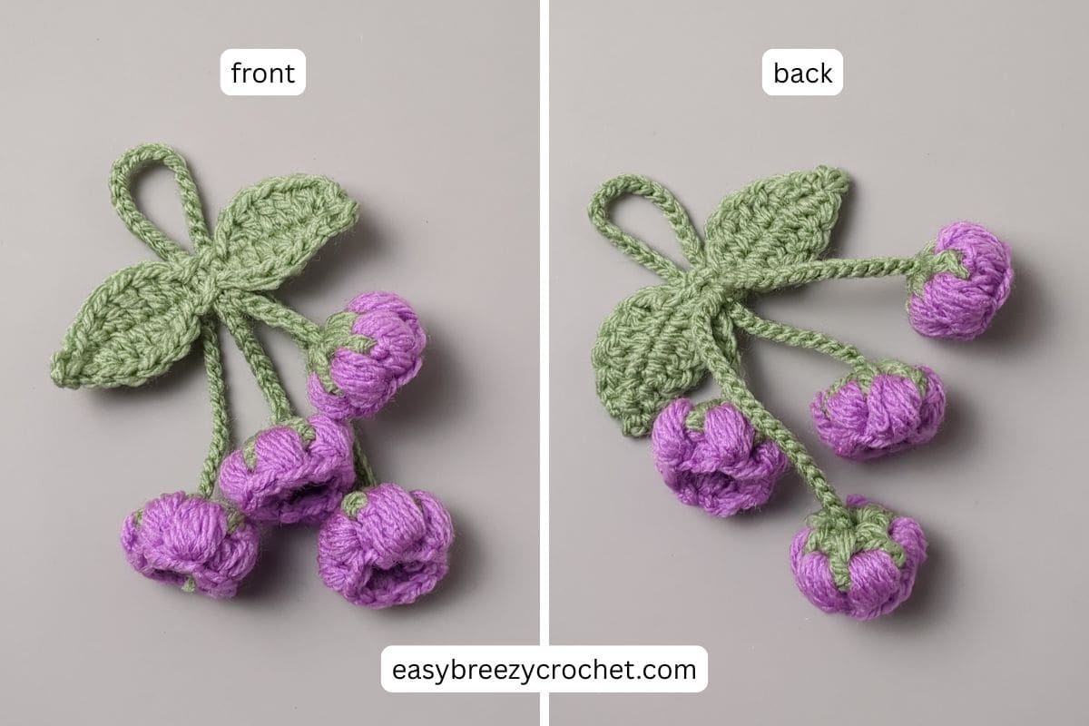 Side by side images showing front and back of a finished crochet flower bag charm.