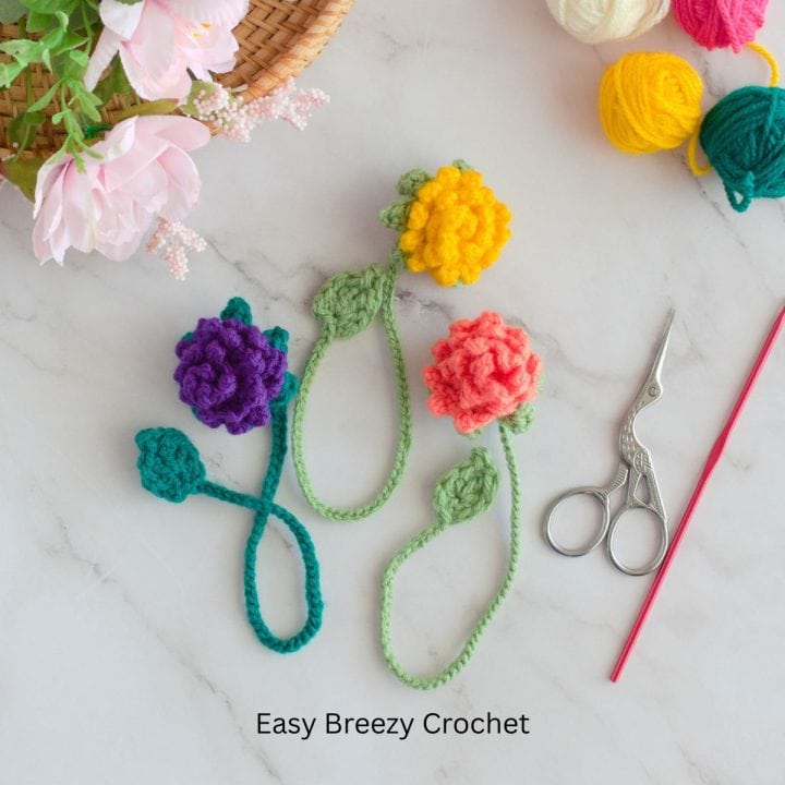 Three crochet flower bookmarks.