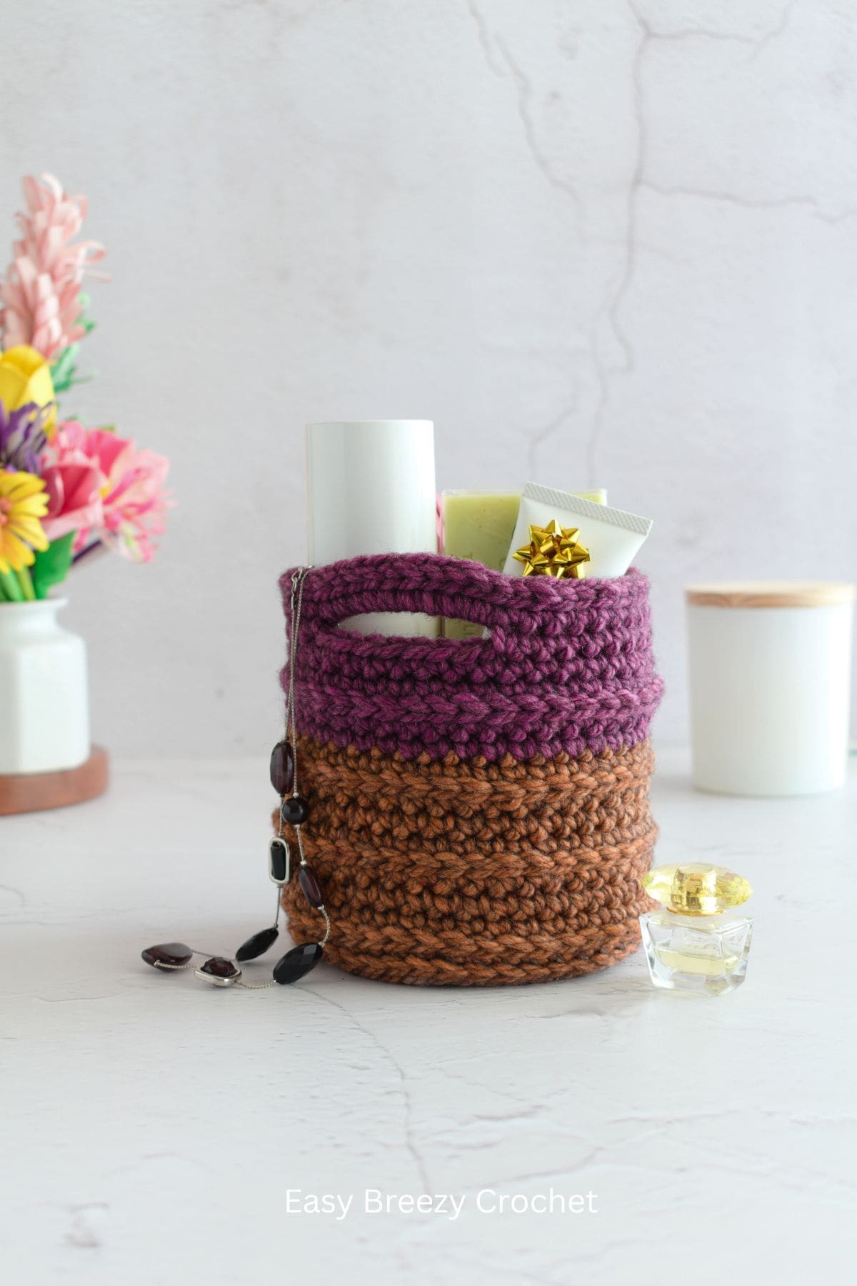 A crochet basket filled with items.