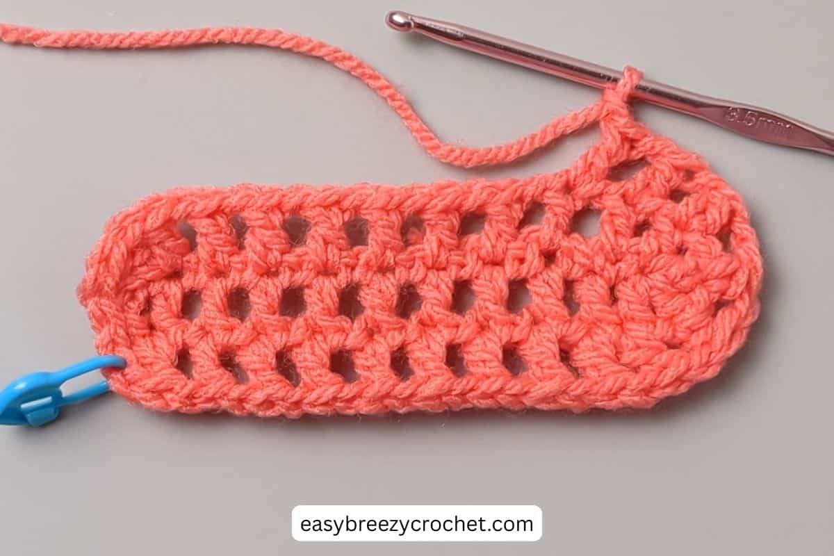 Round two of a crochet mesh bag.