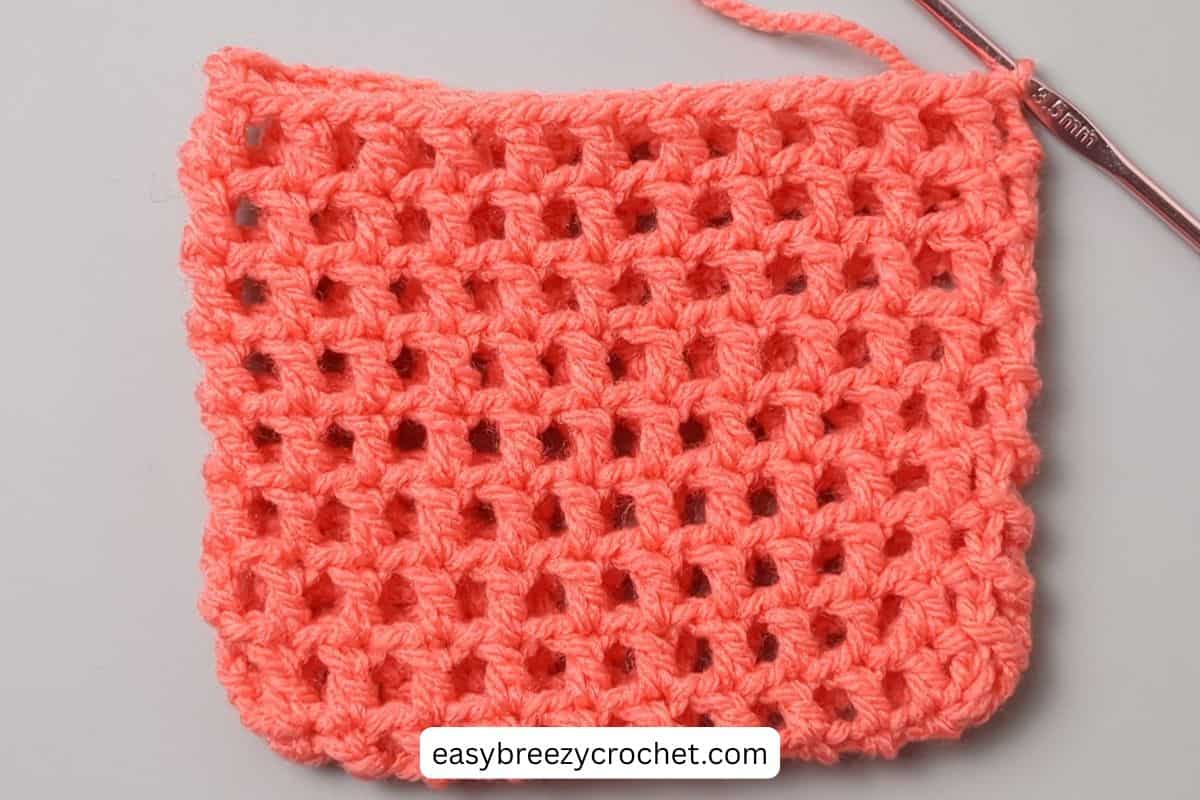Side view of a crochet bag.