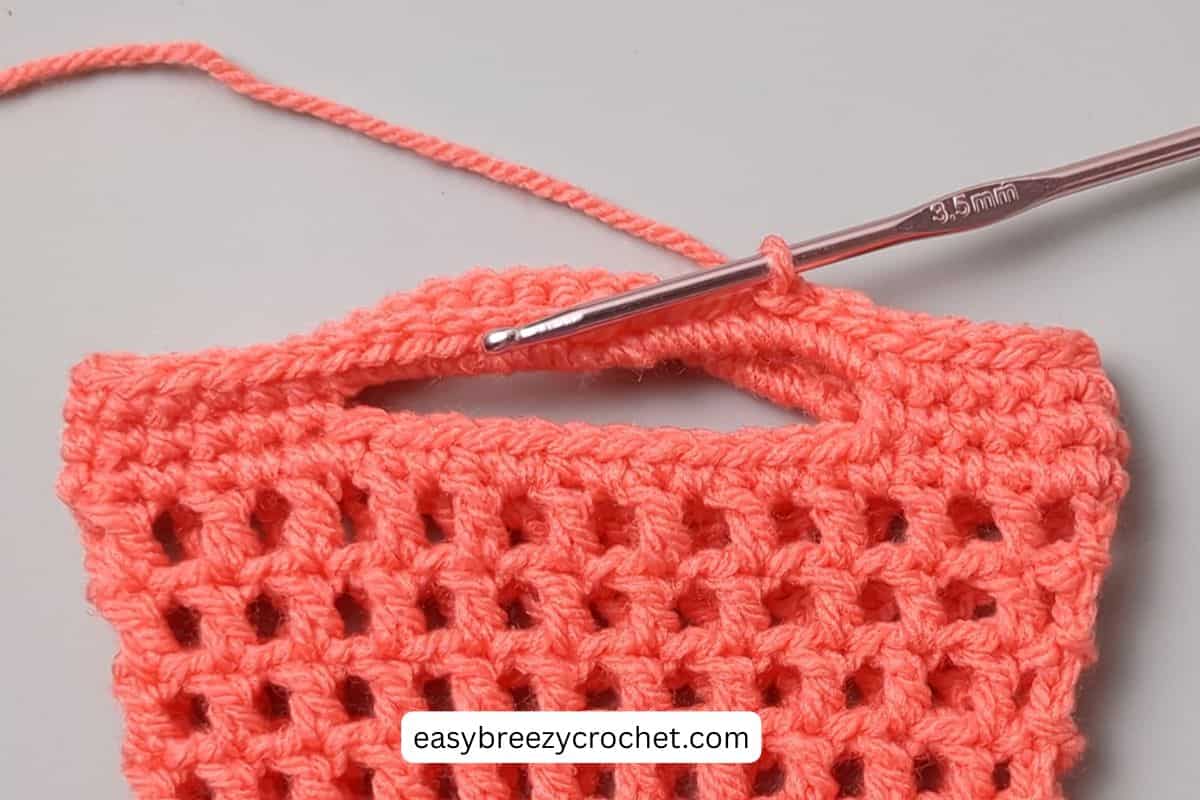 Close up showing slip stitches around the top edge of a small bag.