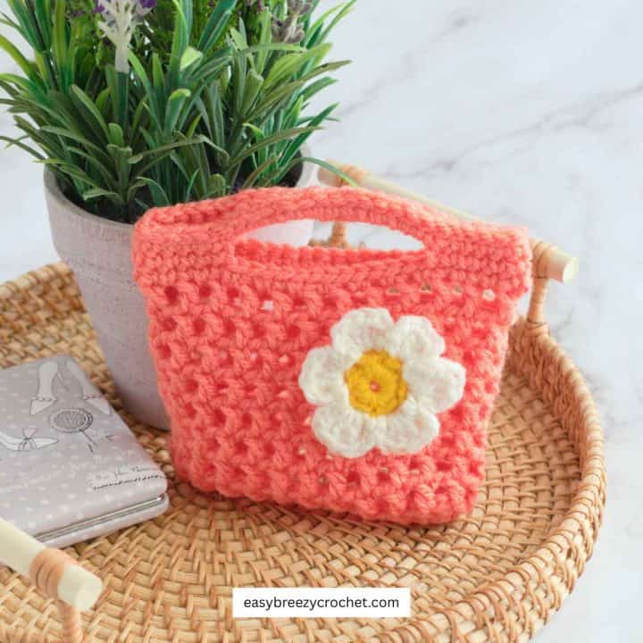 A orange crochet mesh gift bag.