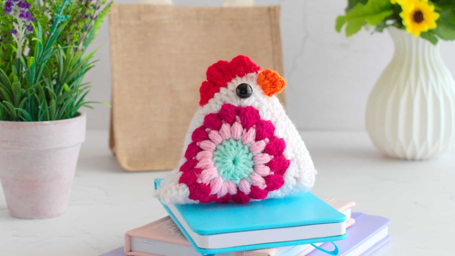Pink and blue sunburst granny square chickent.