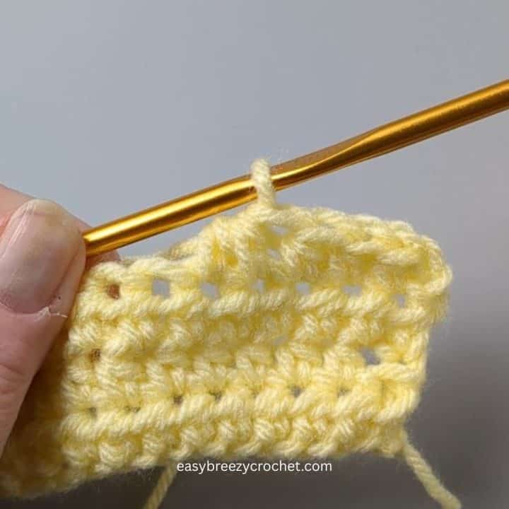 Half double crochet 2 together.