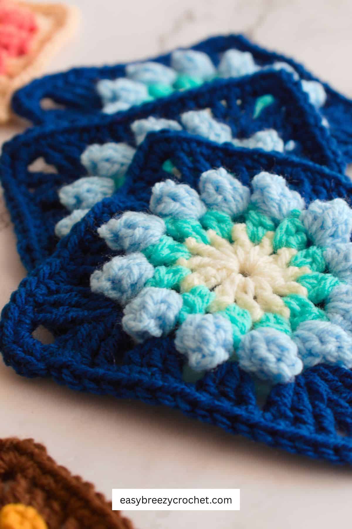 Blue popcorn flower granny square.