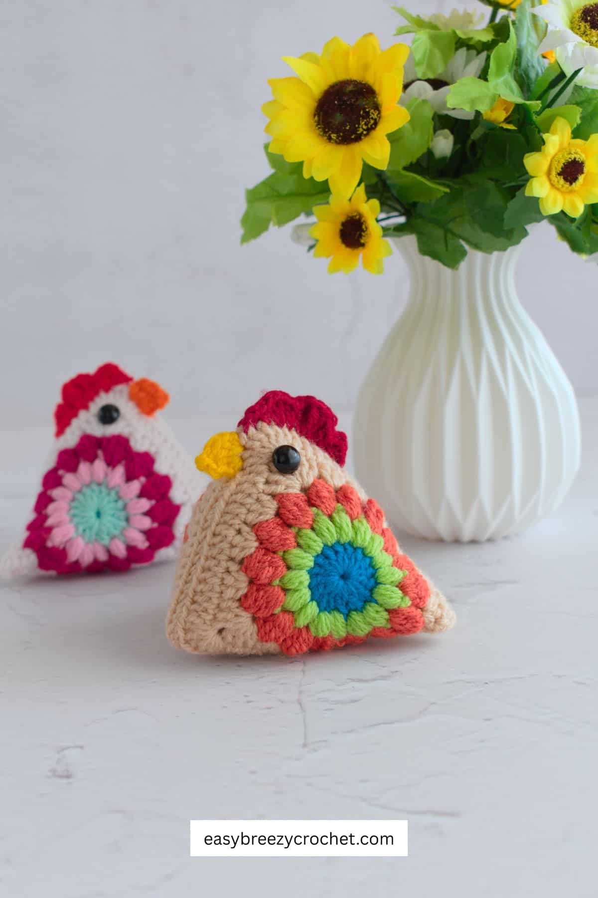 Two sunburst granny square chickens.