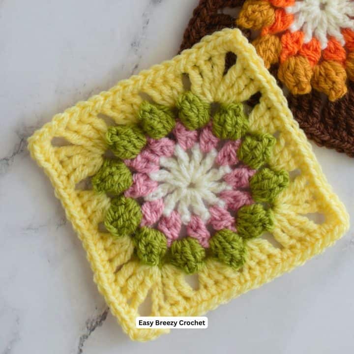 Yellow popcorn flower granny square.