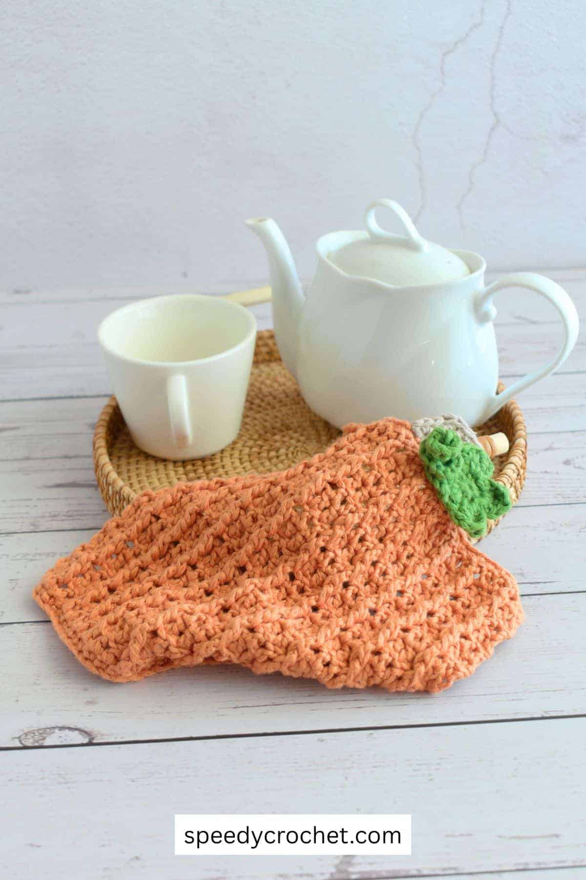 Pumpkin themed crochet dishcloth.